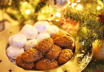 greek melomakarona and kourabies - traditional Christmas cookies with honey and nuts and sugar buns