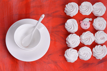 Light and airy marshmallows on a coral-colored background.Fashionable color coral - 2019.painted in the fashionable color of 2019