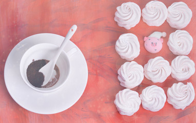 Light and airy marshmallows on a coral-colored background.Fashionable color coral - 2019.painted in the fashionable color of 2019