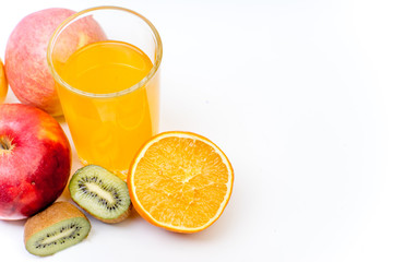 different fruit and juice or smoothie in a glass