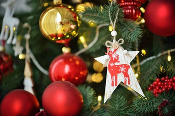 Decorated Christmas tree on blurred, sparkling and fairy background