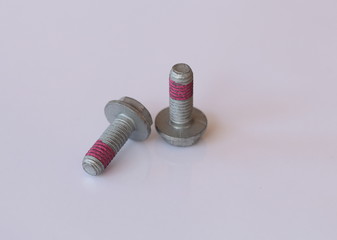 Screws with threadlocker
