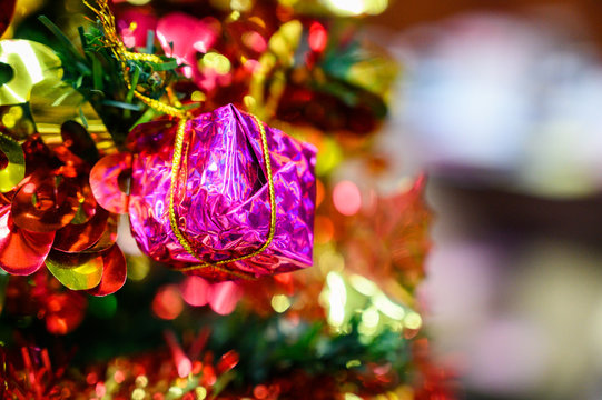 gift boxes decorated with Christmas tree on blurred background. © nattanan