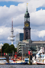 Cityscape of the harbor with the St. Michael's Church (St. Michaelis) and the TV tower (German: Fernsehturm) in Hamburg, Germany.
