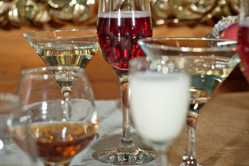 Glass glasses with colored drinks on the table. alcoholic drinks at the buffet