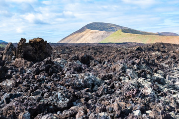 Lava field and tourist road trail to vulcano Caldera Blanca, Lanzarote, Canary Islands, Spain.