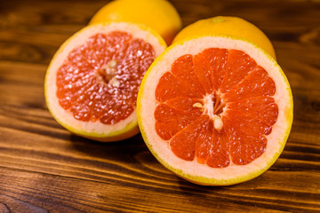 Fototapeta na wymiar Ripe juicy grapefruit on a wooden table