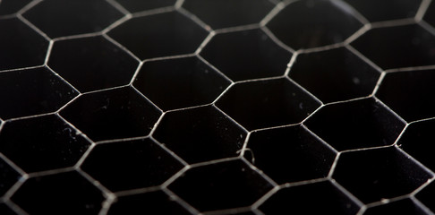 Obraz premium honeycomb pattern on the black rubber mats