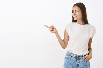 Entertained curious attractive and stylish caucasian girlfriend in white blouse holding hand in...