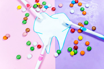 toothbrushes and a toothpaste on a colorful background