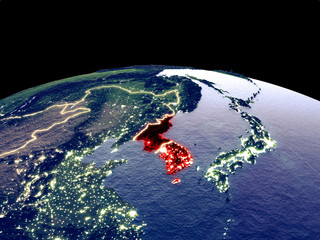 Korea from space on planet Earth at night with bright city lights. Detailed plastic planet surface with real mountains.