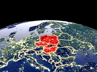 Visegrad Group from space on planet Earth at night with bright city lights. Detailed plastic planet surface with real mountains.