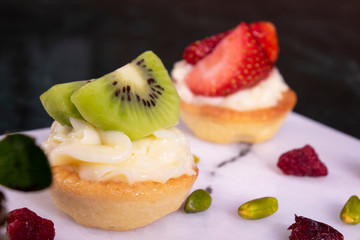 kiwi and strawberry dessert fruit tart pastry with whipped cream, dessert cake