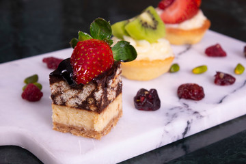 Catering sweets, closeup of various kinds of cakes on event or wedding reception