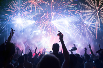 Crowd with Fireworks. New Years Eve concept.
