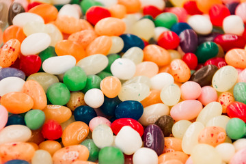 multi-colored candy spread out on a flat surface