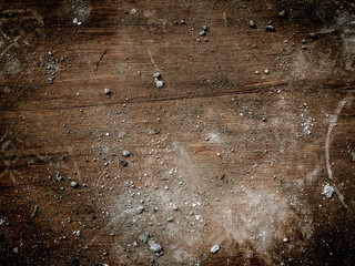 Concrete dust on wood.