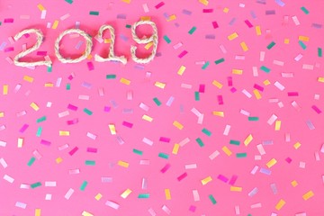 Happy New Year 2019 on pink wooden background