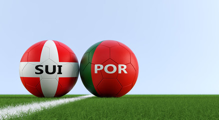 Switzerland vs. Portugal Soccer Match - Soccer balls in Switzerland and Portugal national colors on a soccer field. Copy space on the right side - 3D Rendering 