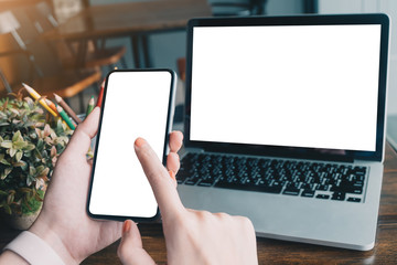 Close up Woman hand Using a Smart Phone with blank screen at cafe coffee shop. - Image