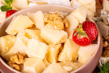 Lumpy parmesan, is served with berries fresh and nuts