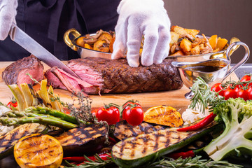 Giving of fried meat with potato and mushrooms