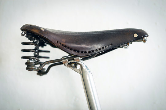 Vintage leather saddle with spring shock absorber