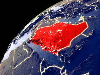 Satellite view of Saudi Arabia on Earth with city lights. Extremely detailed plastic planet surface with real mountains.