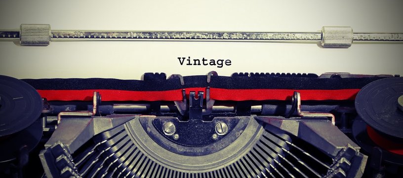 text VINTAGE with the typewriter with old toned effect