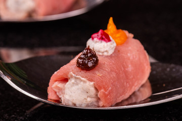 A meat roll with berry, creamy and pumpkin mousse