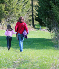 mother and her little girl walking