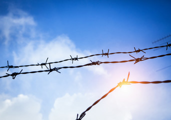The silhouette Barbed wire fence,made from iron,thorn and rust from long time used