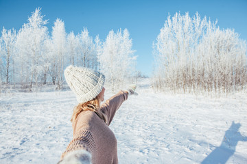 Woman in gloves in magic winter day