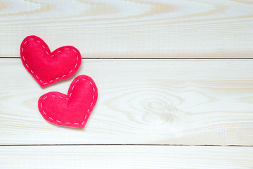 Valentine's day background with hearts on the wooden table, top view