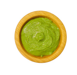 Wasabi  paste in wooden bowl isolated on white background