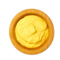 Cheese sauce in wooden bowl isolated on white background.Top view