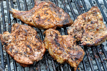 Group grilled ribeye beef steaks on the grill outdoor, background. barbecue season concept,
