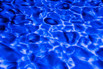 Blue light wave pattern on stone background