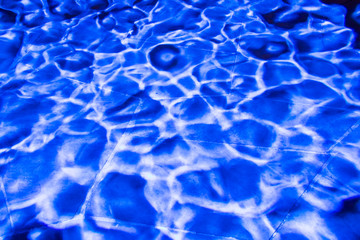 Blue light wave pattern on stone background