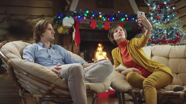 Pretty woman takes photo of herself with her man on Christmas night