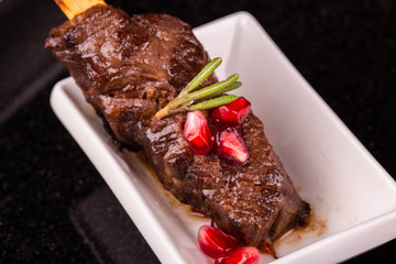 Pomegranate seeds with meat a grill on a skewer
