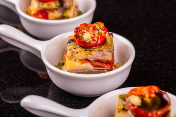 A vegetable lasagna in sauce with nuts 