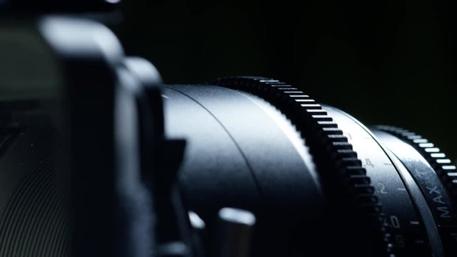 Cinematographer (camera operator) working with a cinema camera at night