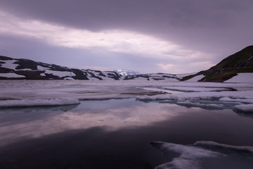 Iced lake at norwegian mountains, Norway.