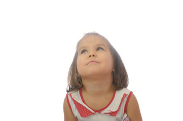 dreaming little girl. child portrait looking up happy smiling isolated on white background