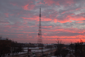 Crimson dawn on the background of the TV tower in the early morning