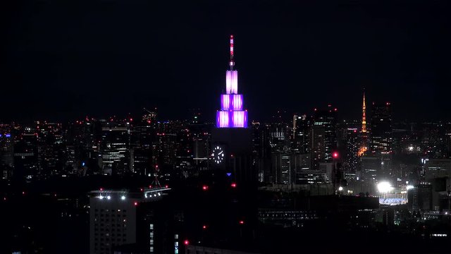 Tokyo night skyline with the clock of Docomo Tower. Shinjuku, Tokyo, Japan