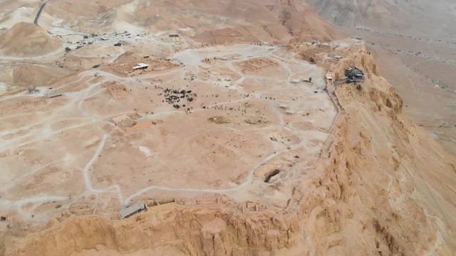 flying around Masada fortress area Southern District of Israel Dead Sea area Southern District of Israel. Ancient Jewish fortress of the Roman Empire on top of a rock in the Judean desert. view air.