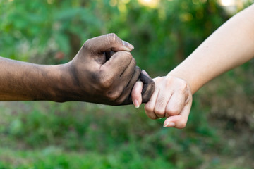 close up man and woman hands touching holding together on blurred background for love valentine day concept, shake hand with a dirty hand and a clean, Stained,