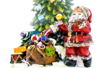 Glass ball with snow along with Santa Claus and gifts